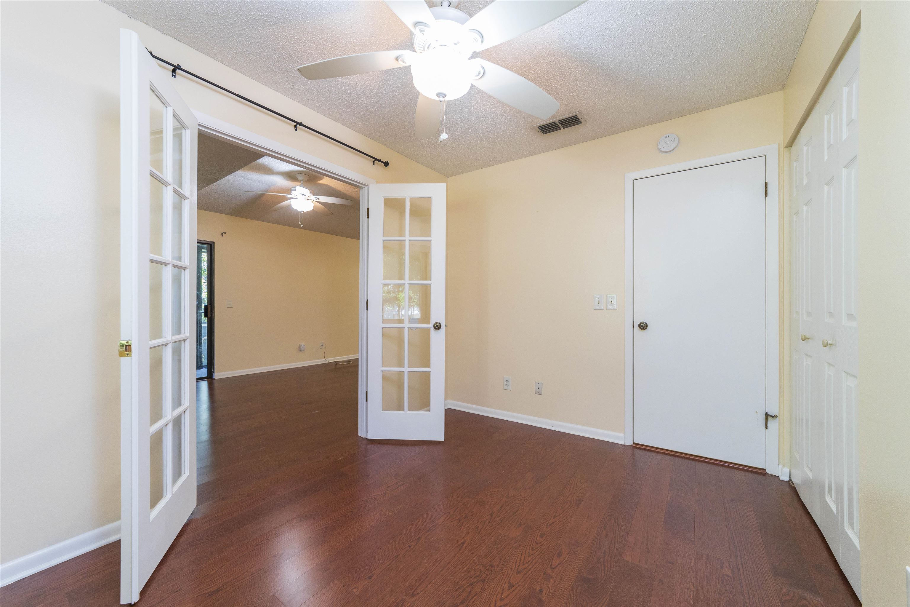 2 Catalonia Court St. Augustine, FL 32086 - Photo 24 of 28 an empty room with wooden floor fan and windows