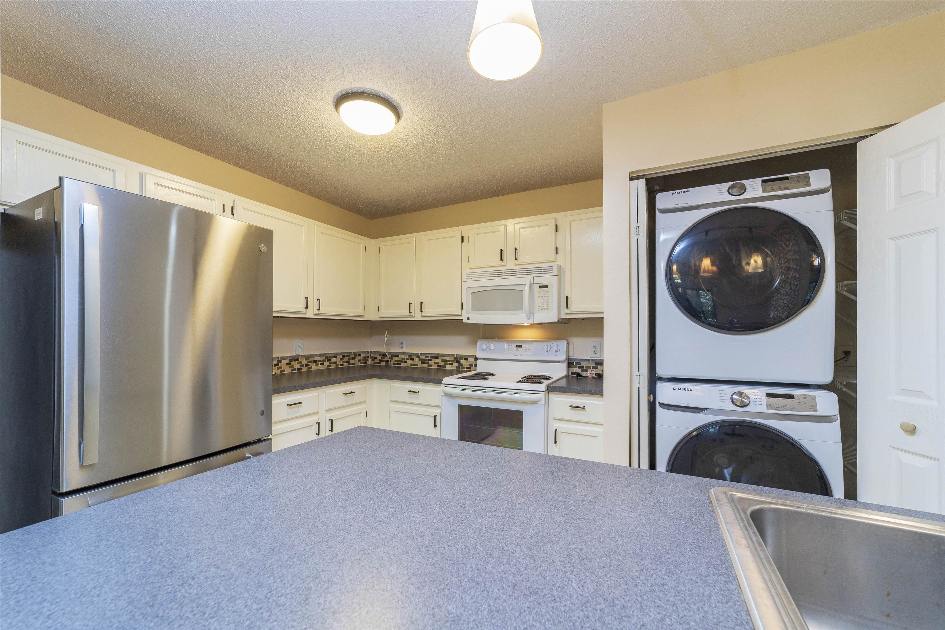 2 Catalonia Court St. Augustine, FL 32086 - Photo 7 of 28 a kitchen with a refrigerator sink and stove top oven