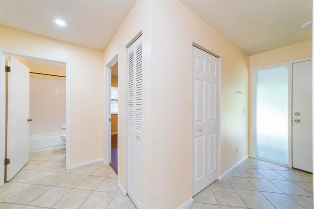 a view of a hallway with closet area