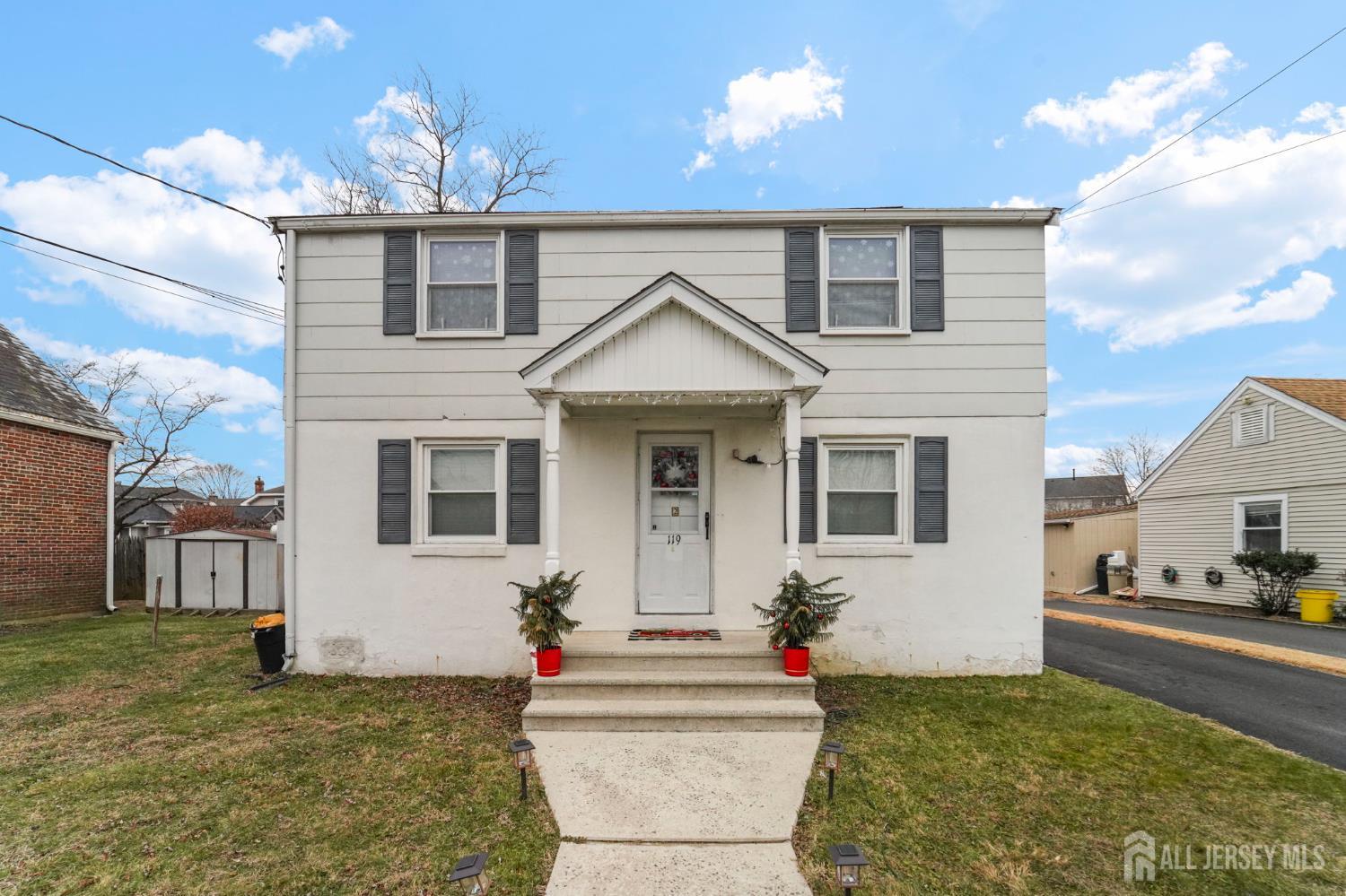 a front view of a house with a yard