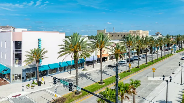 a view of swimming pool with sitting area