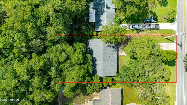 a bedroom with a bed and a mirror