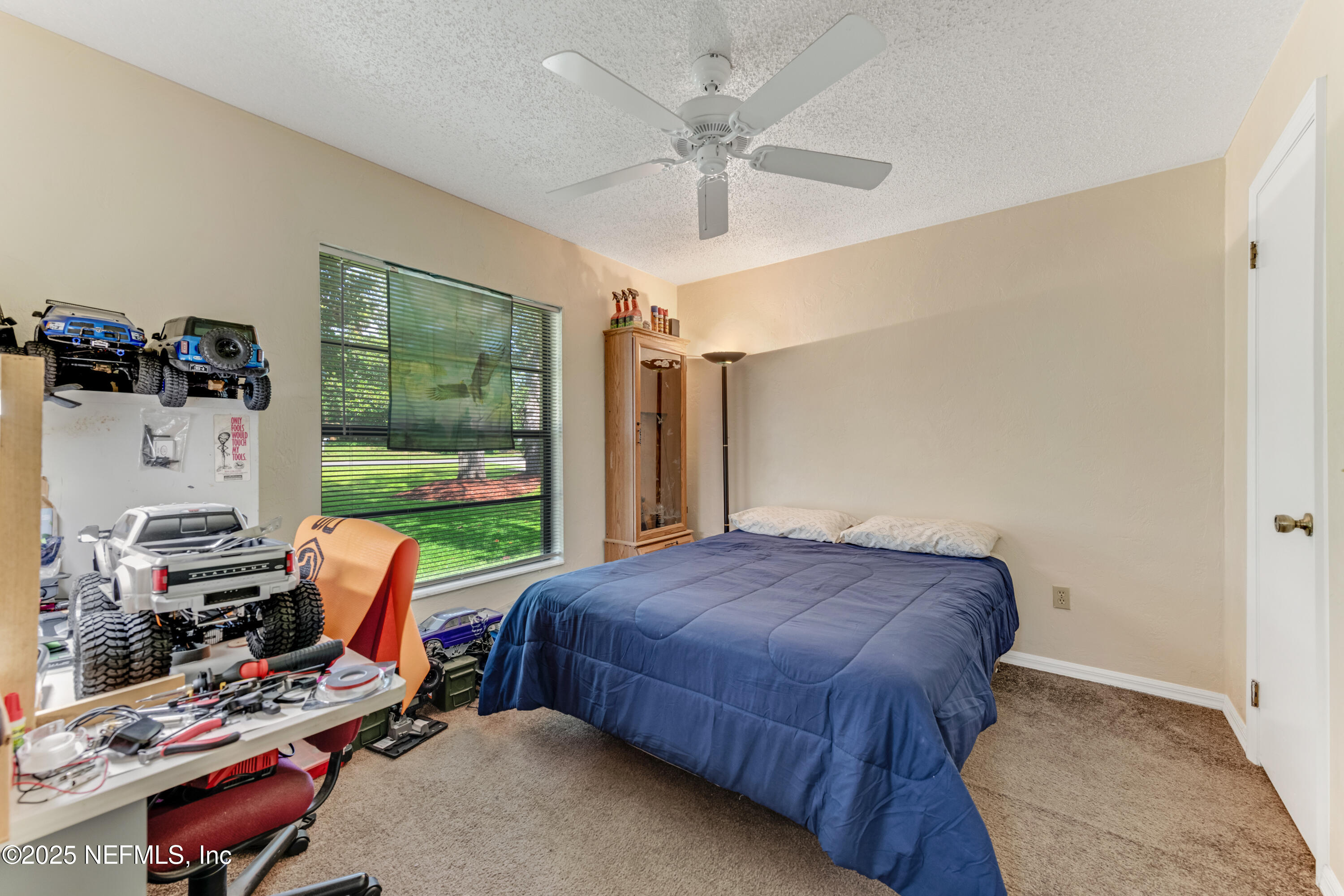 1399 Old Kings Road Daytona Beach, FL 32117 - Photo 4 of 27 a bedroom with a bed furniture and a window