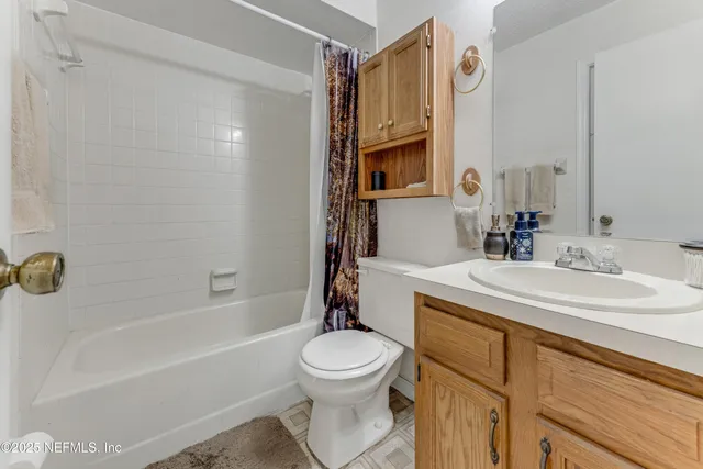 a kitchen with a sink window and cabinets