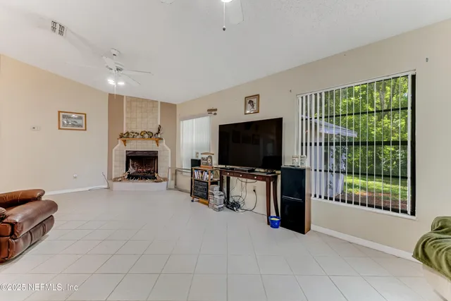 a bed room with a bed and a television