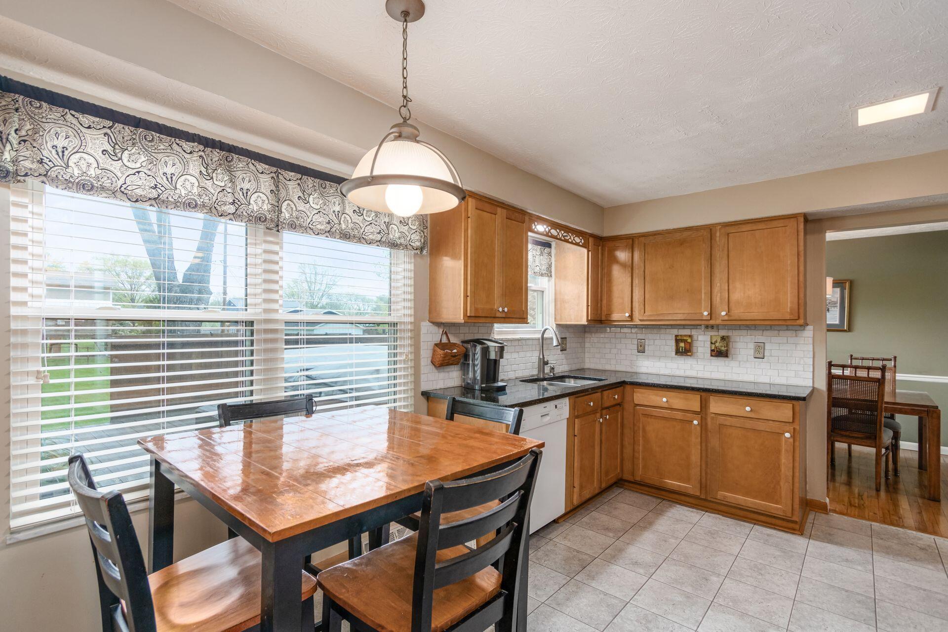 2404 Merbrook Road Columbus, OH 43235 - Photo 15 of 55 Kitchen & Daily Dining - 14'0" x 10'6" - Stainless Steel Appliances, Granite Countertops, Tile Floor, Pantry