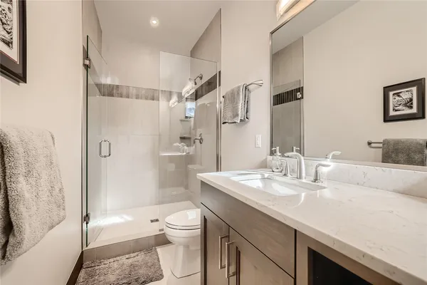 a bathroom with a double vanity sink and mirror