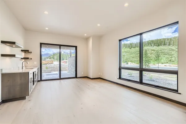 a kitchen with a sink and a mirror