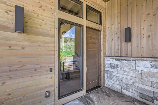 a view of a balcony with wooden floor