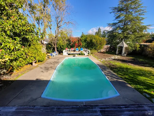 a view of an outdoor space with a swimming pool