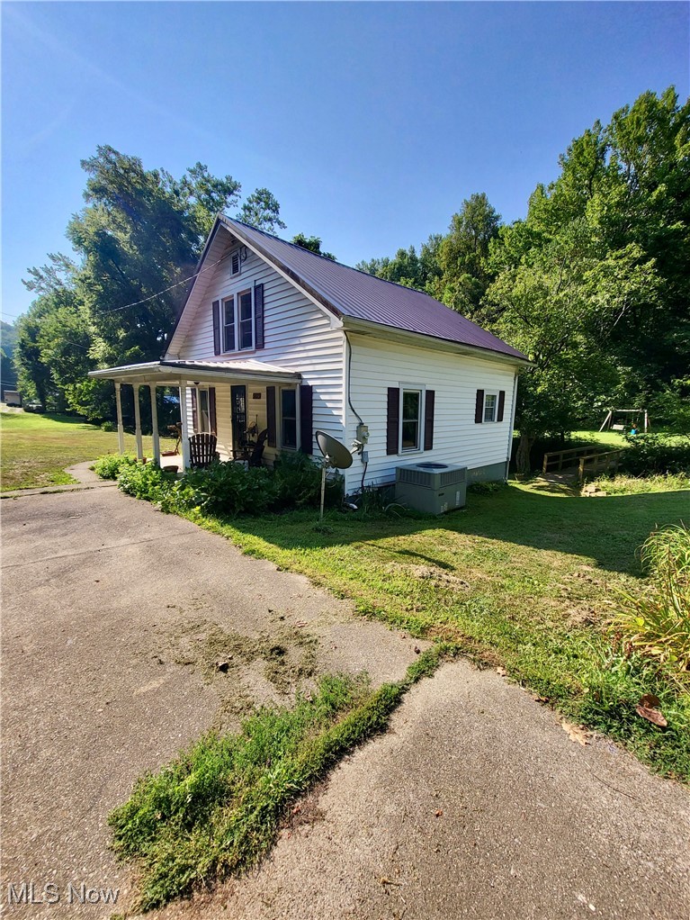 5103 Rte 10 Barboursville, WV 25504 - Photo 2 of 16 View of front of home featuring a front yard and covered porch