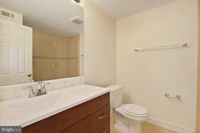 a bathroom with a sink toilet and vanity
