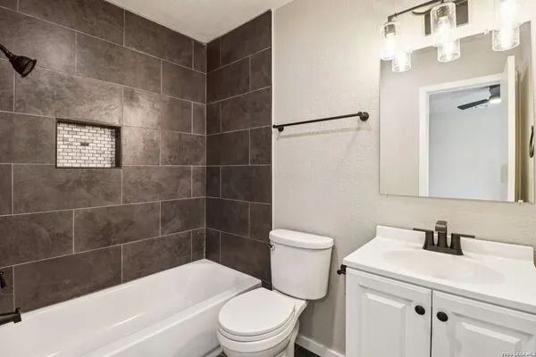 a bathroom with a sink a toilet and a bathtub