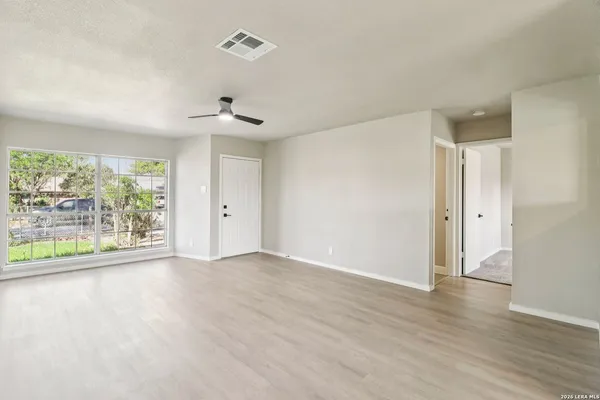 a view of an empty room with a window