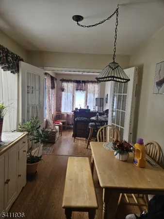 a kitchen with a refrigerator and a stove top oven