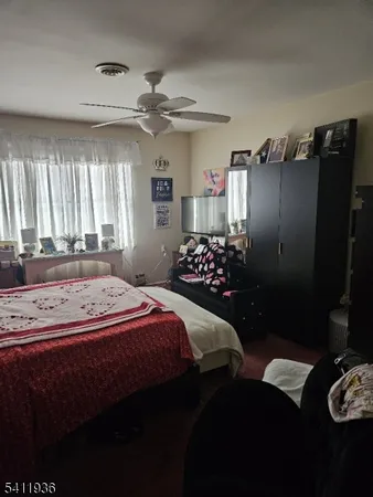 a bedroom with a bed and a closet