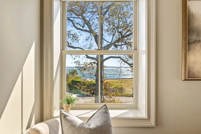 a view of a large window with a view of the house