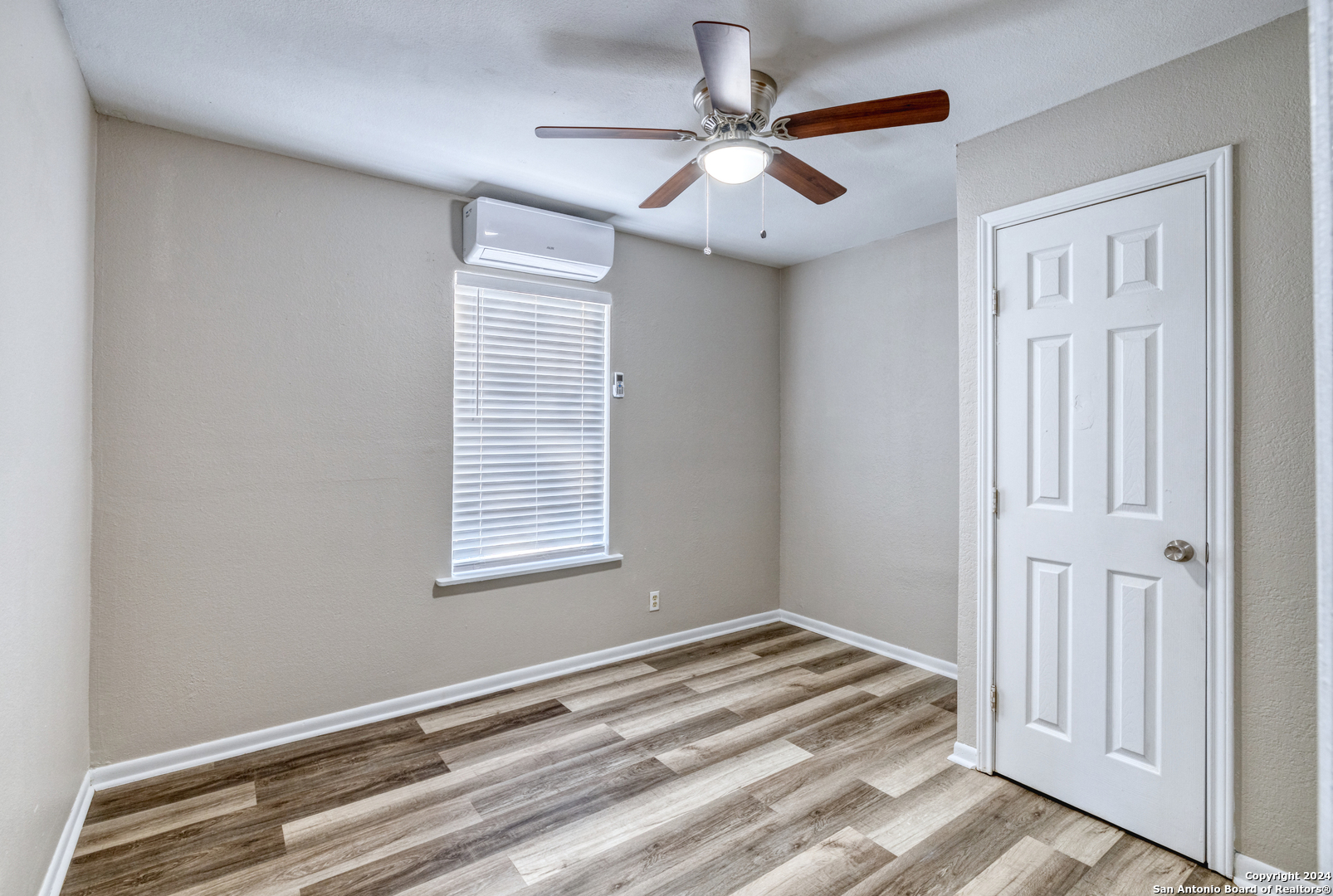 640 Roach Street Uvalde, TX 78801 - Photo 12 of 23 a view of a livingroom with a ceiling fan and window