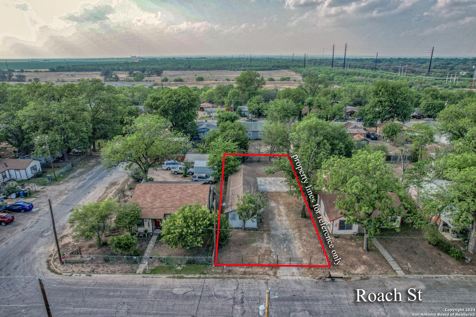 640 Roach Street Uvalde, TX 78801 - Photo 14 of 23 an aerial view of a house with a yard and mountain view in back