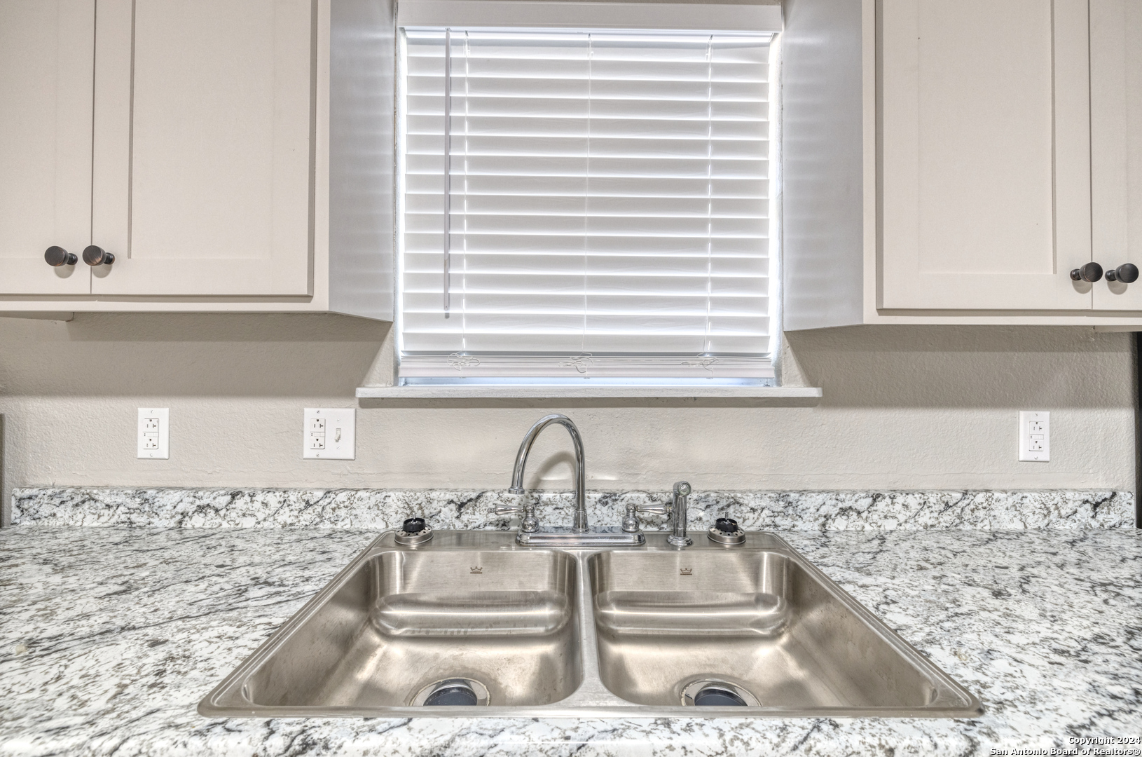 640 Roach Street Uvalde, TX 78801 - Photo 8 of 23 a view of a kitchen with a sink and a window