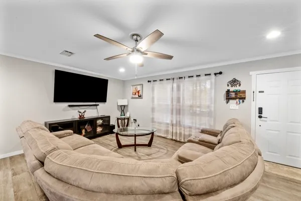a living room with furniture and a flat screen tv