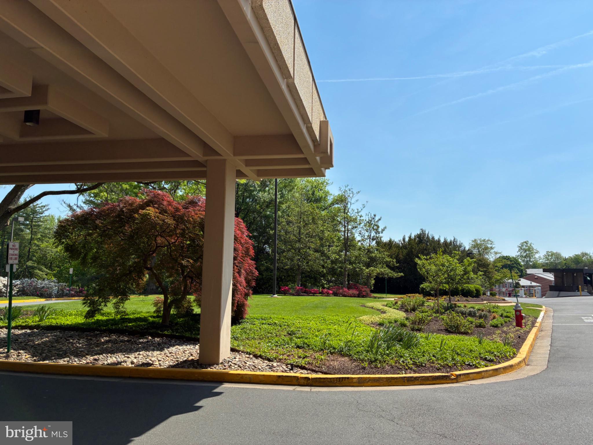 1800 Old Meadow Road, Unit 101 McLean, VA 22102 - Photo 1 of 50 a view of a backyard with a garden and plants