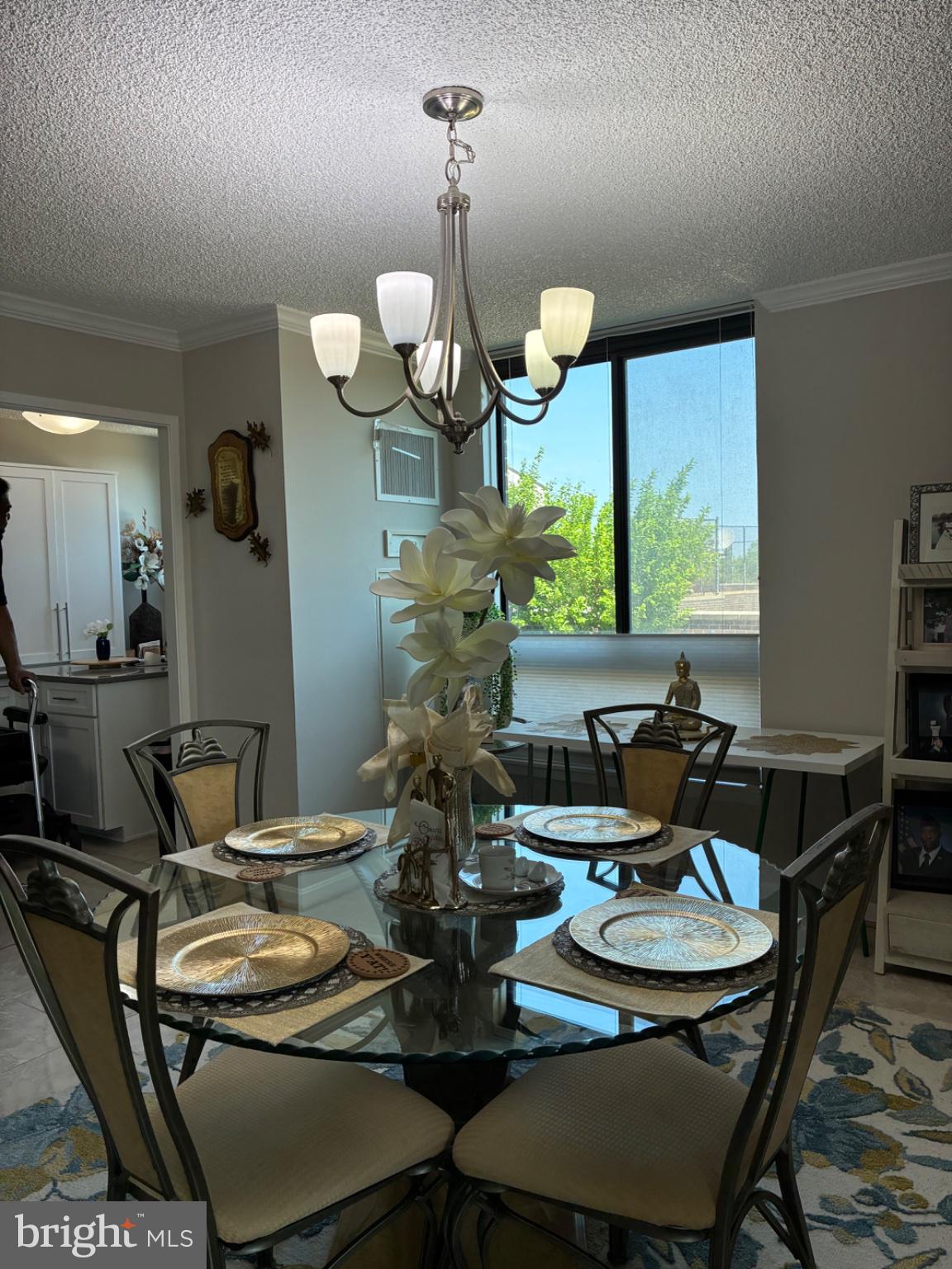 1800 Old Meadow Road, Unit 101 McLean, VA 22102 - Photo 30 of 50 a view of a dining room with furniture and chandelier