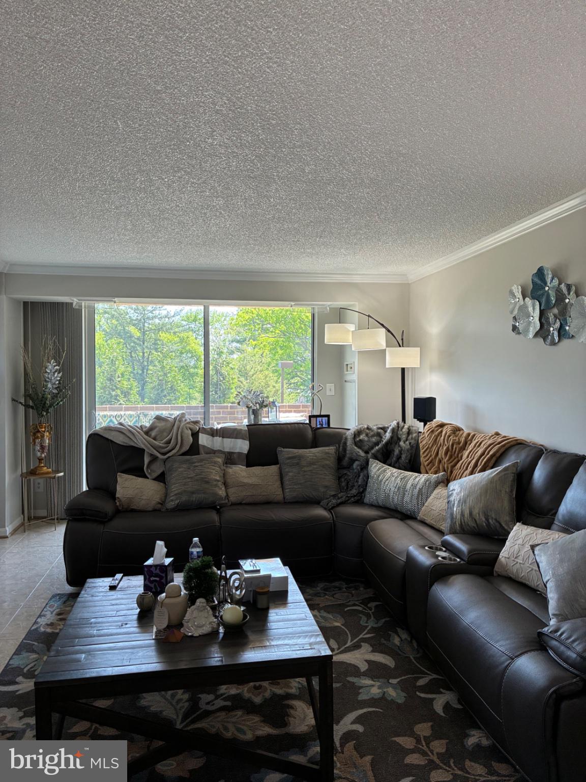 1800 Old Meadow Road, Unit 101 McLean, VA 22102 - Photo 36 of 50 a living room with furniture and a large window