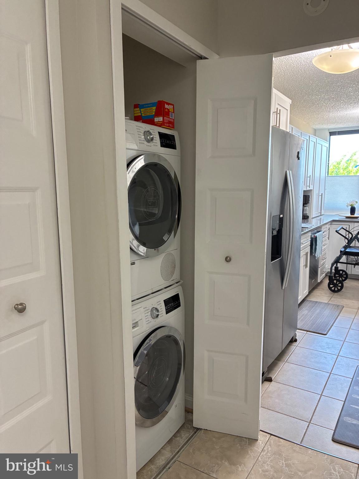 1800 Old Meadow Road, Unit 101 McLean, VA 22102 - Photo 41 of 50 a view of a hallway with washer and dryer