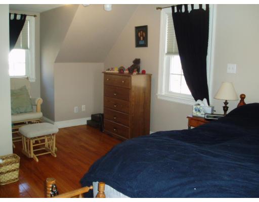 54 Clark Road Newton, MA 02465 - Photo 5 of 8 a bedroom with a bed and wooden floor