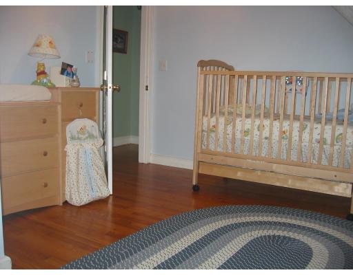 54 Clark Road Newton, MA 02465 - Photo 6 of 8 wooden floor with a book shelf