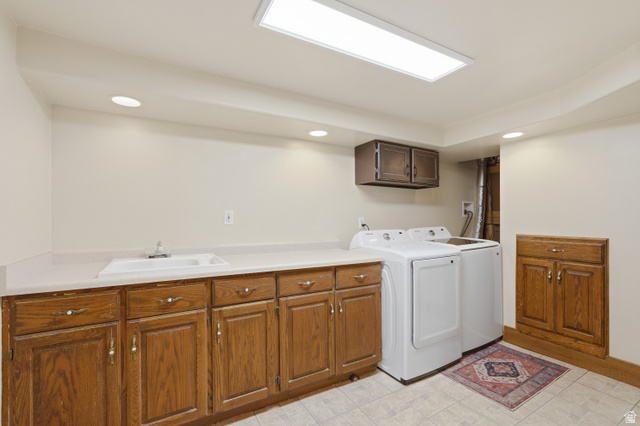 378 West 200 South Bountiful, UT 84010 - Photo 24 of 32 Utility area featuring extensive wood cabinetry, a utility sink, and ample countertop space