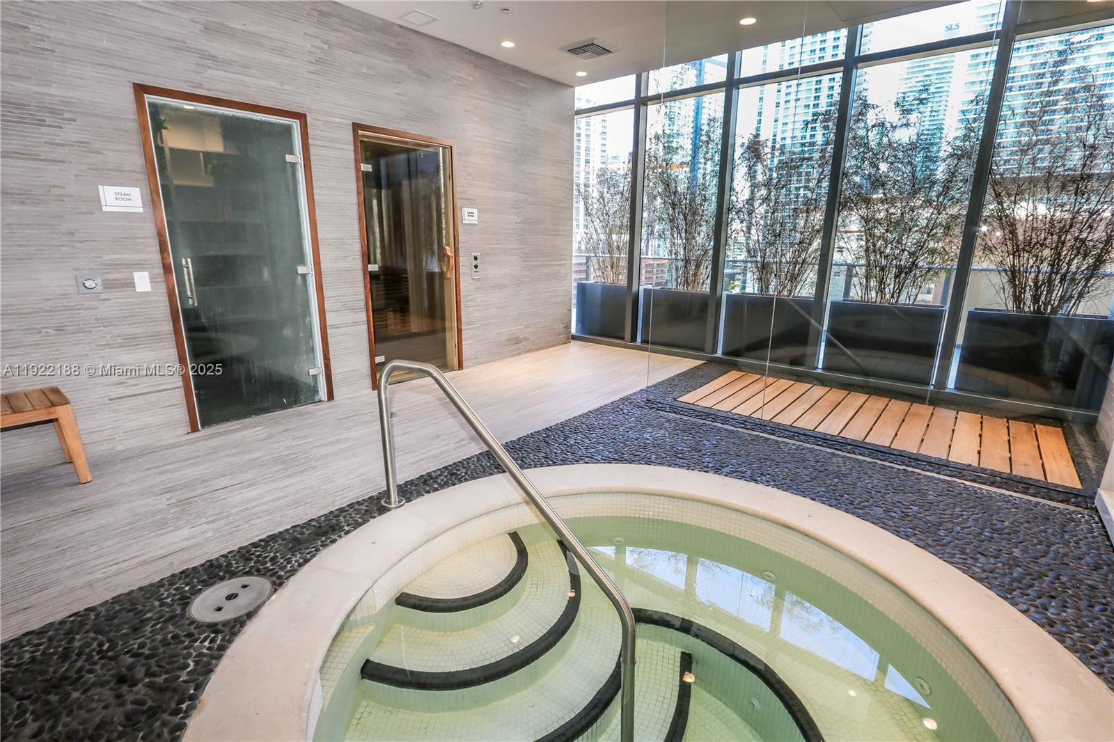 45 Southwest 9th Street, Unit 2201 Miami, FL 33130 - Photo 22 of 28 a indoor swimming pool with a balcony view