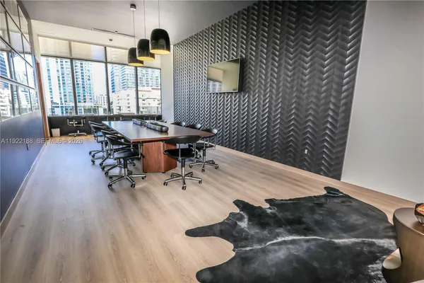a room with lots of windows and couch