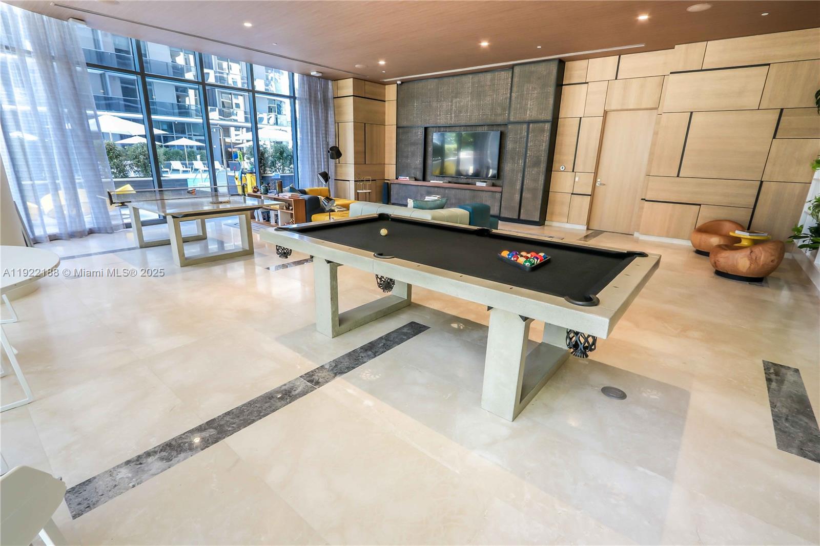 45 Southwest 9th Street, Unit 2201 Miami, FL 33130 - Photo 27 of 28 a living room with furniture a large window and gym equipment