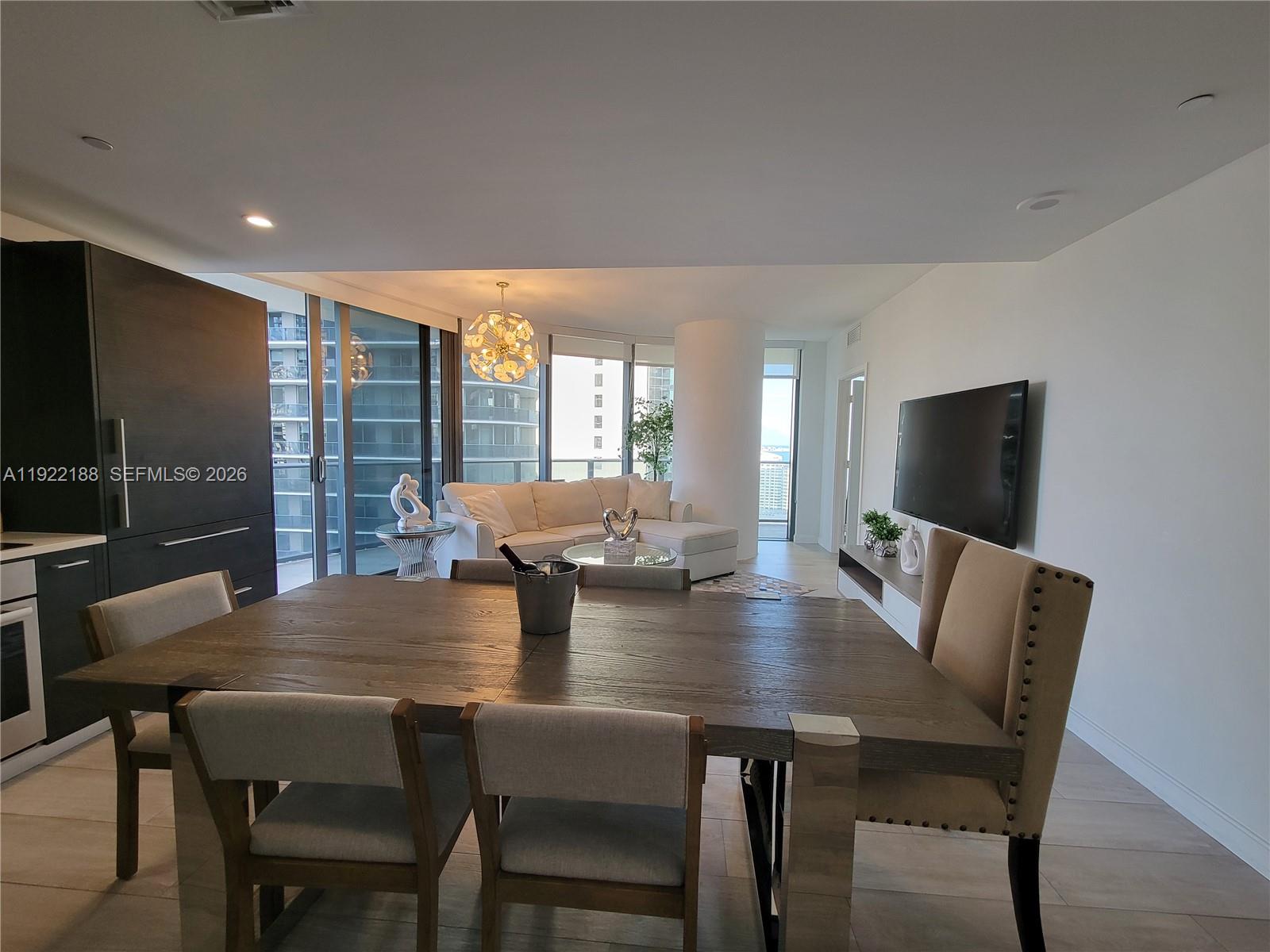 45 Southwest 9th Street, Unit 2201 Miami, FL 33130 - Photo 10 of 36 a view of a dining room with furniture