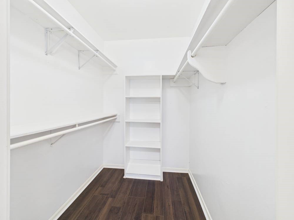 8315 Lichen Lane Spring, TX 77379 - Photo 15 of 31 a view of walk in closet with empty racks