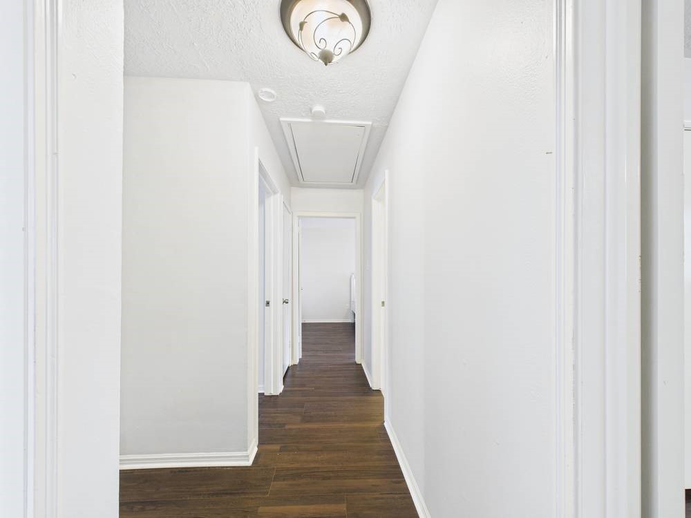 8315 Lichen Lane Spring, TX 77379 - Photo 19 of 31 a view of a hallway with wooden floor