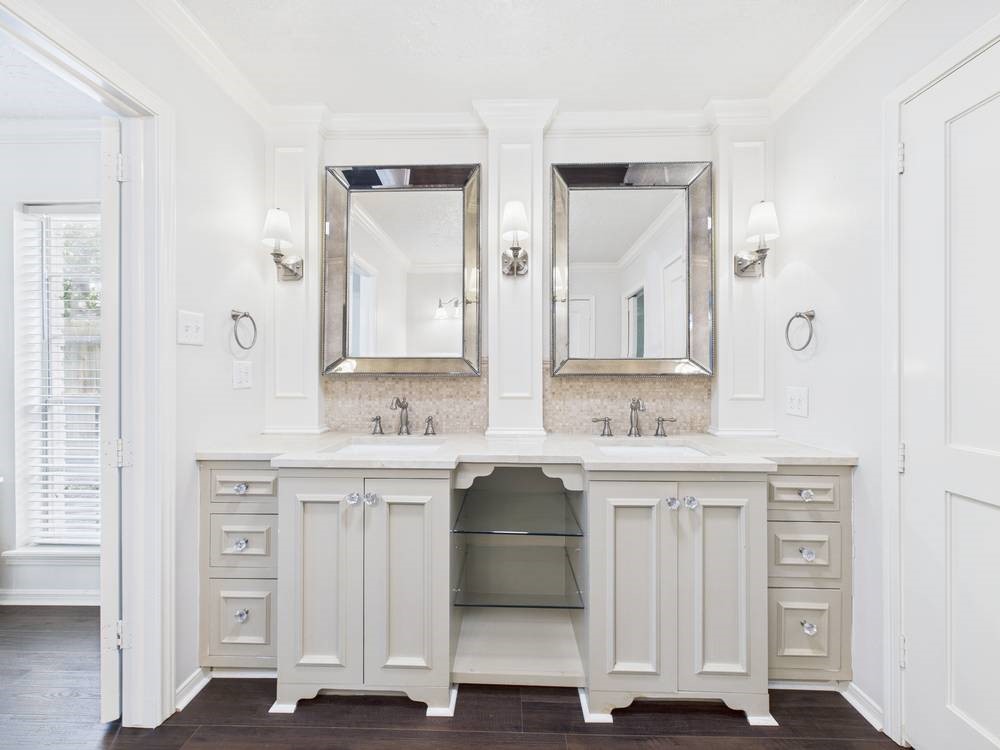 8315 Lichen Lane Spring, TX 77379 - Photo 2 of 31 a bathroom with a sink and a mirror