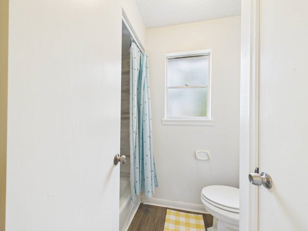 8315 Lichen Lane Spring, TX 77379 - Photo 24 of 31 a bathroom with a granite countertop toilet and a sink