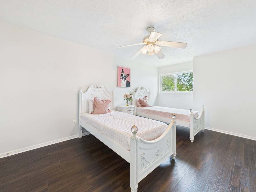 8315 Lichen Lane Spring, TX 77379 - Photo 27 of 31 a view of a room with wooden floor and ceiling fan