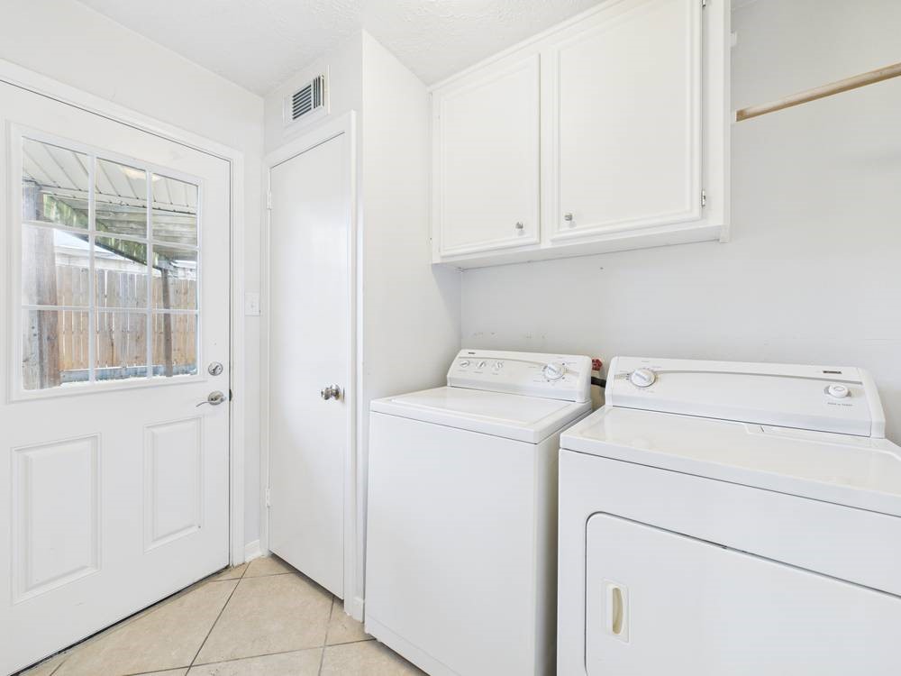 8315 Lichen Lane Spring, TX 77379 - Photo 29 of 31 a view of storage and utility room with washer and dryer