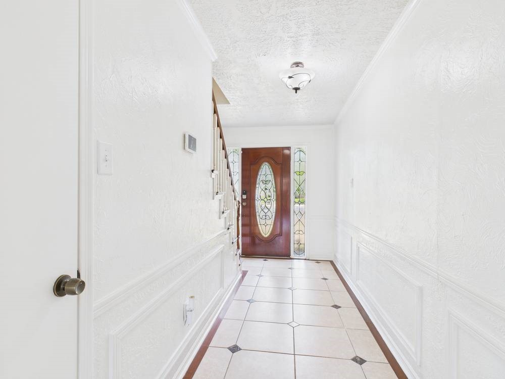 8315 Lichen Lane Spring, TX 77379 - Photo 7 of 31 a view of a hallway with a white walls