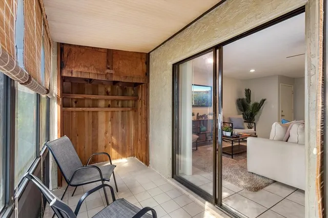 a view of a chair and table in a room