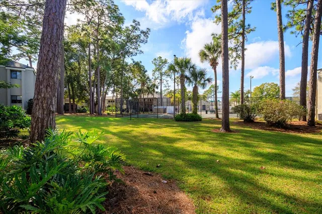 a view of a tennis court with basket ball court