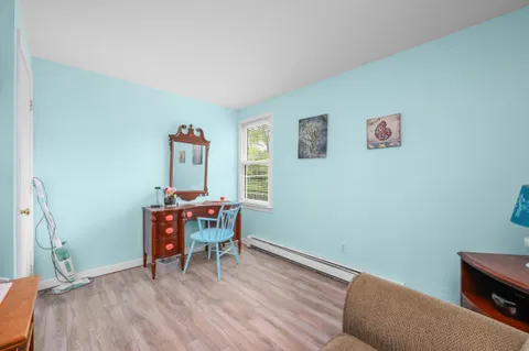 a view of a livingroom with furniture and wooden floor