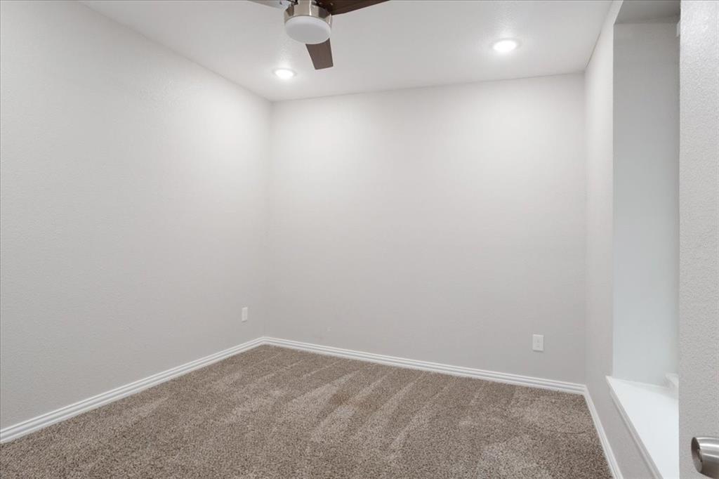 721 Maple Street Bonham, TX 75418 - Photo 18 of 30 an empty room with a empty space and windows
