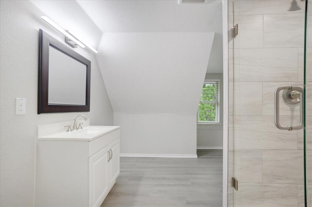 721 Maple Street Bonham, TX 75418 - Photo 23 of 30 a bathroom with a sink and a mirror