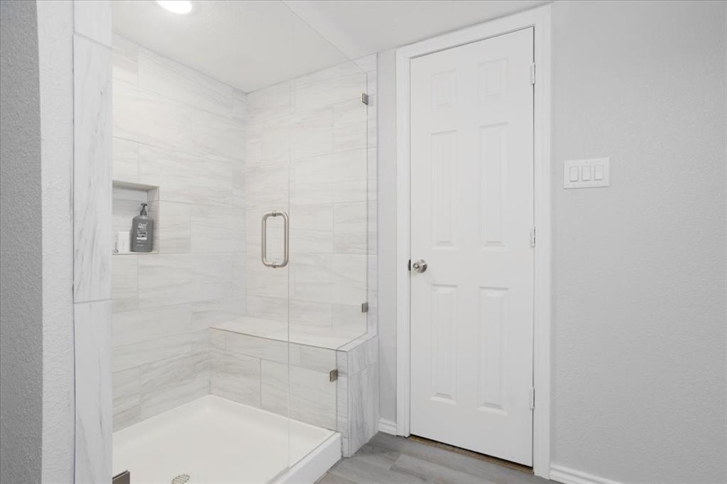 721 Maple Street Bonham, TX 75418 - Photo 24 of 30 a bathroom with a shower