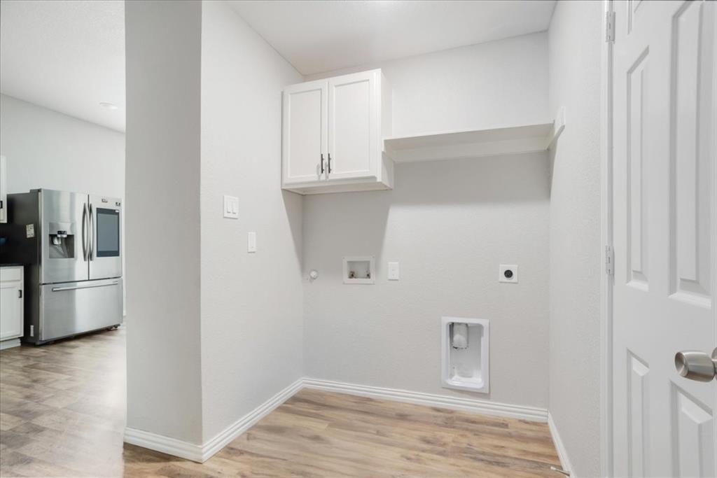 721 Maple Street Bonham, TX 75418 - Photo 25 of 30 a view of empty room with wooden floor
